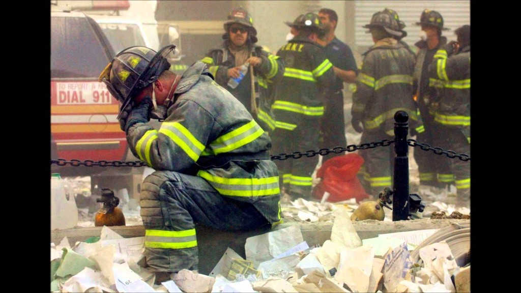 A firefighter breaks down after the World Trade Center buildings collapsed September 11.MARIO TAMA / GETTY IMAGES