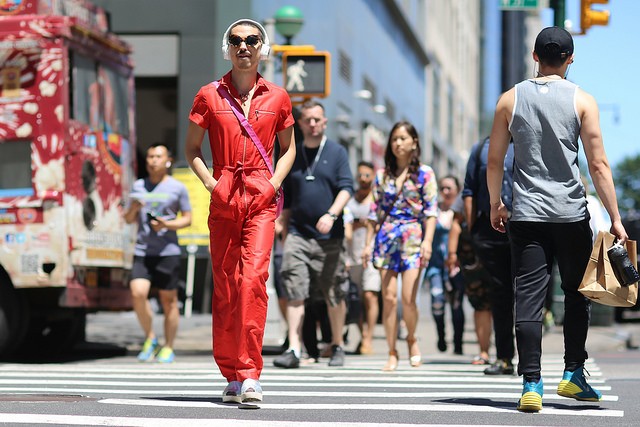 A guy crossing 57th Street along 8th Avenue.