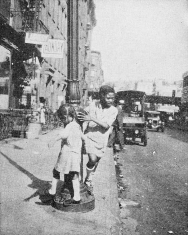 Old days in Harlem: There are few playgrounds in Harlem. Negro children must play on the streets