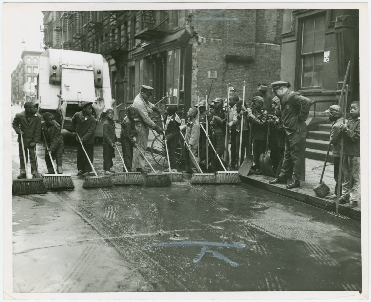 Old days in Harlem: Group of Harlem youths recruited as street sweepers on 117th Street, ca. 1940s