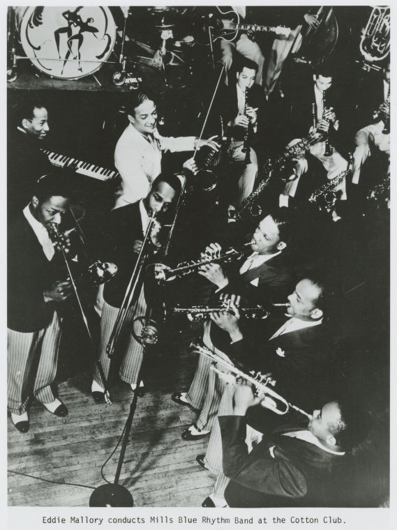 Old days in Harlem: Eddie Mallory conducts Mills Blue Rhythm Band at the Cotton Club.